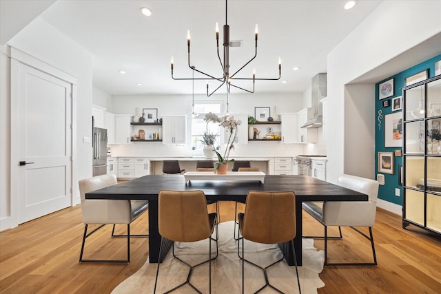 1402 Missouri Unit B, Houston, TX 77006 - dining room featuring a chandelier, light wood-type flooring, recessed lighting, and baseboards