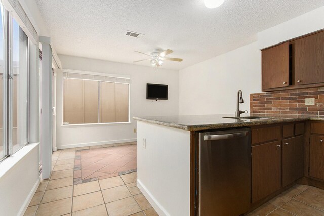 11625 Lakeside Park Dr, Houston, TX 77077 - kitchen with dishwasher, a ceiling fan, light tile patterned floors, decorative backsplash, and a textured ceiling
