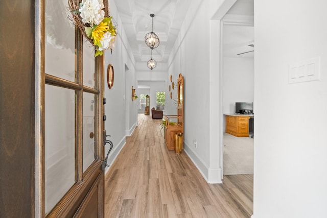 204 Terrain View Ct, Willis, TX 77318 - hall featuring light wood-type flooring, a chandelier, and baseboards