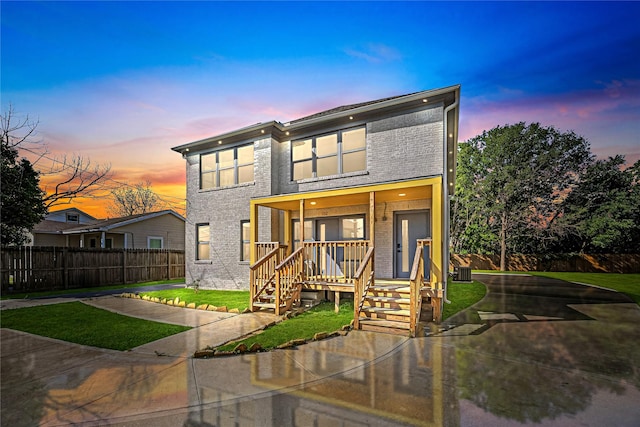 102 Glendale St, Houston, TX 77012 - modern home featuring brick siding and a porch