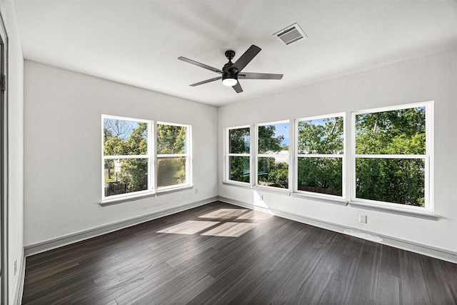 102 Glendale St, Houston, TX 77012 - empty room with ceiling fan, dark wood-style floors, and baseboards