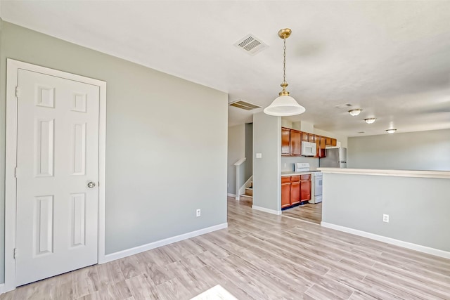 19747 Byron Meadows Dr, Katy, TX 77449 - unfurnished living room featuring light wood-style flooring and baseboards