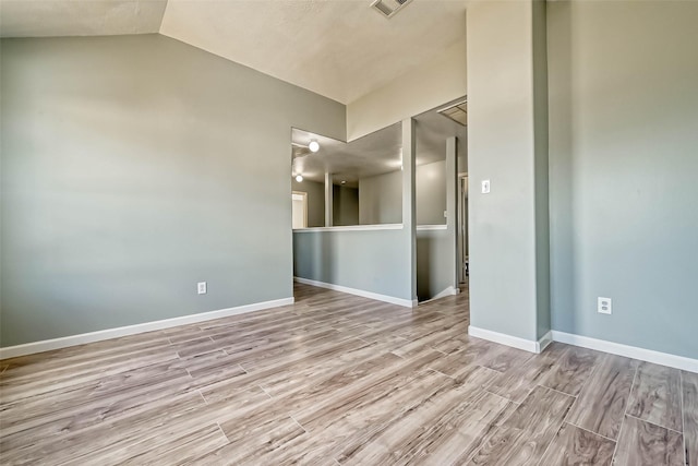19747 Byron Meadows Dr, Katy, TX 77449 - spare room with wood finished floors, lofted ceiling, and baseboards