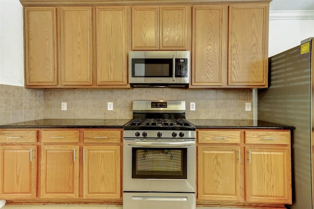 316 Magnolia Way, League City, TX 77573 - kitchen featuring appliances with stainless steel finishes, tasteful backsplash, and light brown cabinetry