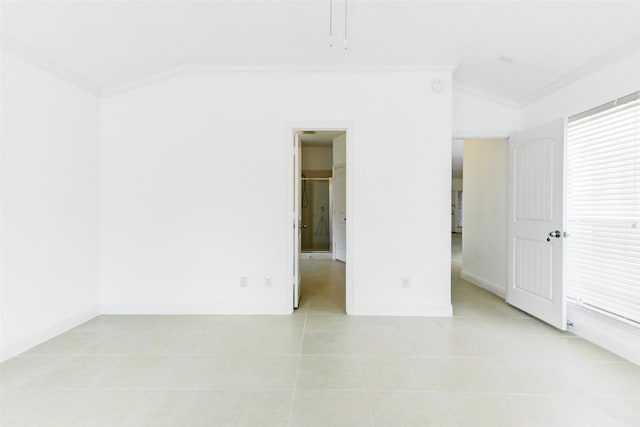 316 Magnolia Way, League City, TX 77573 - unfurnished bedroom featuring crown molding, light tile patterned flooring, and baseboards