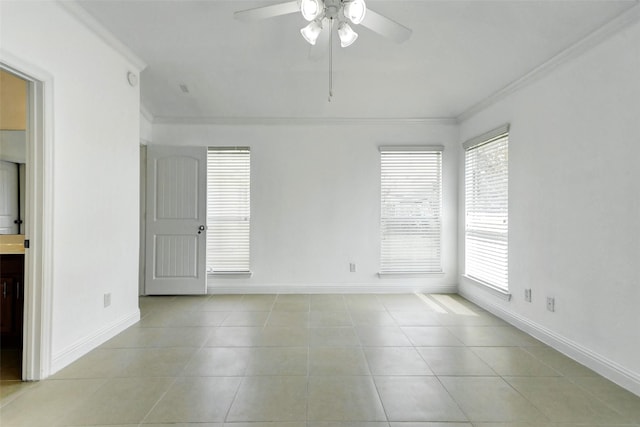 316 Magnolia Way, League City, TX 77573 - spare room featuring ornamental molding, a ceiling fan, baseboards, and light tile patterned floors
