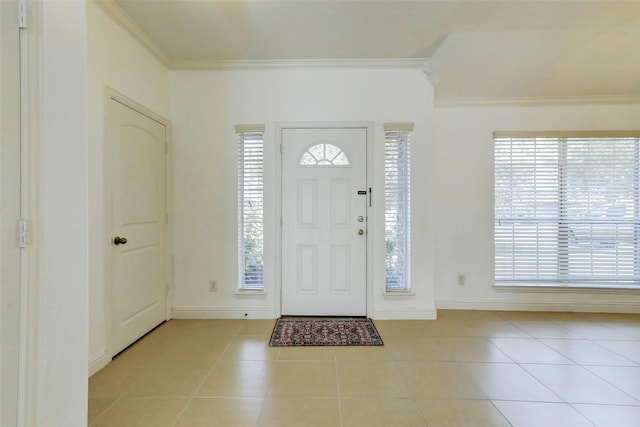 316 Magnolia Way, League City, TX 77573 - tiled entryway with crown molding, plenty of natural light, and baseboards