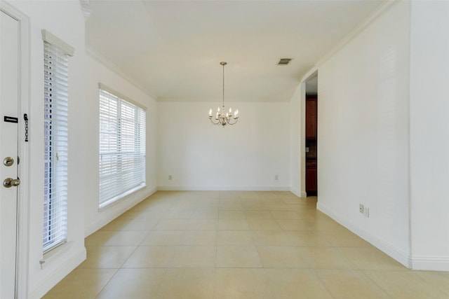 316 Magnolia Way, League City, TX 77573 - unfurnished room with a chandelier, baseboards, light tile patterned floors, and crown molding
