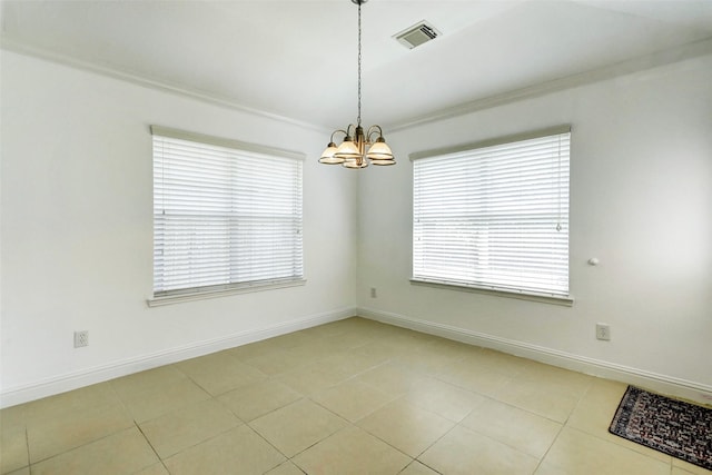 316 Magnolia Way, League City, TX 77573 - spare room featuring a chandelier, plenty of natural light, crown molding, light tile patterned floors, and baseboards