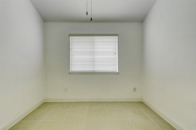 316 Magnolia Way, League City, TX 77573 - empty room with light tile patterned floors and baseboards
