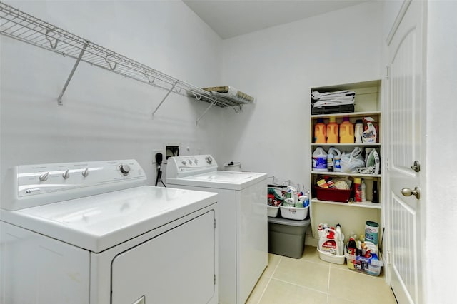 316 Magnolia Way, League City, TX 77573 - washroom featuring washing machine and clothes dryer and light tile patterned floors