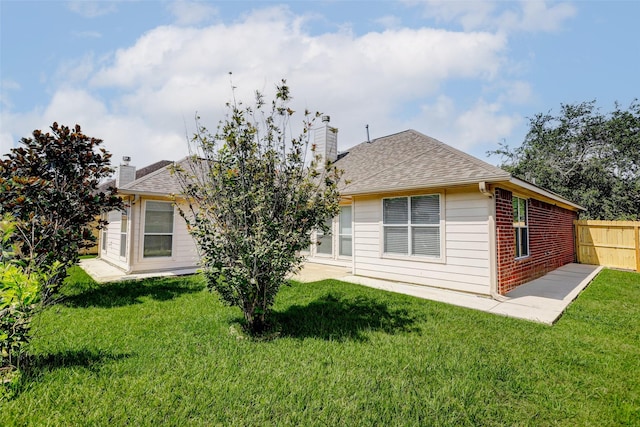 316 Magnolia Way, League City, TX 77573 - rear view of house with a chimney, brick siding, roof with shingles, and a patio area