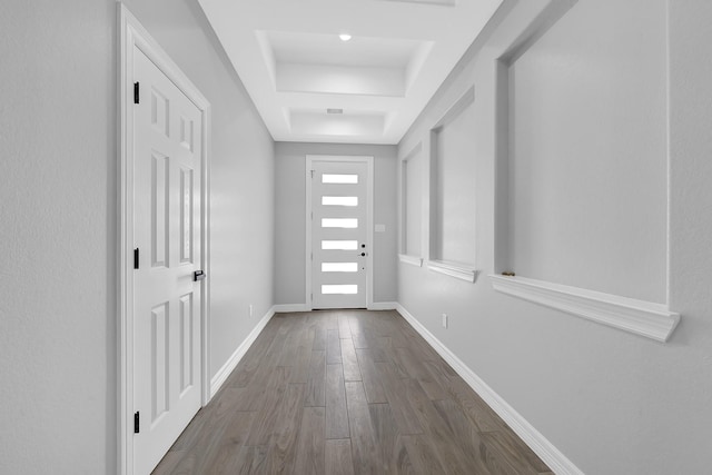 2506 Myrtle St, Waller, TX 77484 - doorway to outside with dark wood-style floors, baseboards, and a tray ceiling