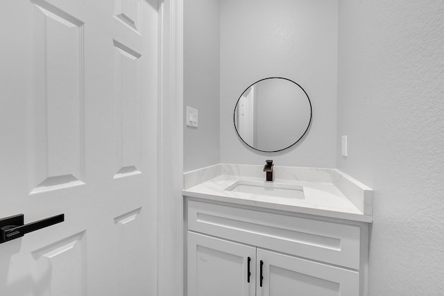 2506 Myrtle St, Waller, TX 77484 - bathroom featuring vanity and a textured wall