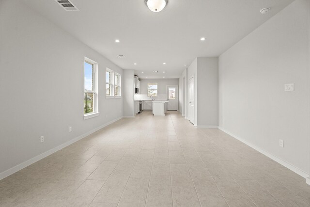 13122 Leisure Cove Dr, Texas City, TX 77568 - unfurnished living room featuring recessed lighting, baseboards, and light tile patterned flooring