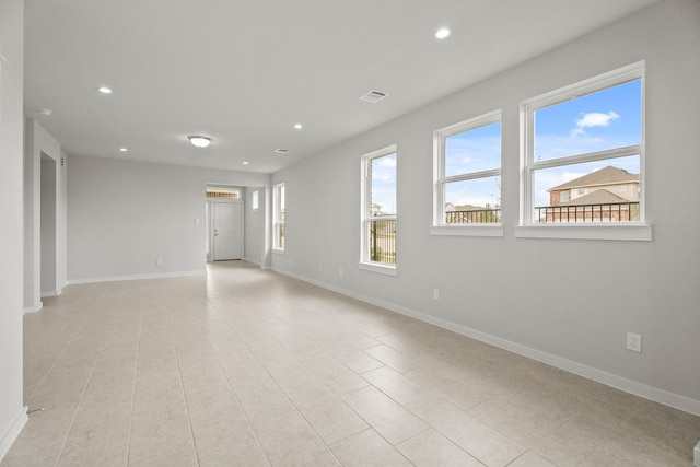 13122 Leisure Cove Dr, Texas City, TX 77568 - spare room featuring recessed lighting, baseboards, and light tile patterned floors