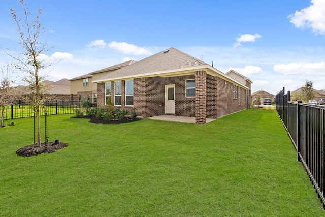 13122 Leisure Cove Dr, Texas City, TX 77568 - back of property with brick siding, a patio area, and a shingled roof