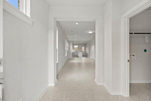 13122 Leisure Cove Dr, Texas City, TX 77568 - corridor with light tile patterned floors, baseboards, and recessed lighting