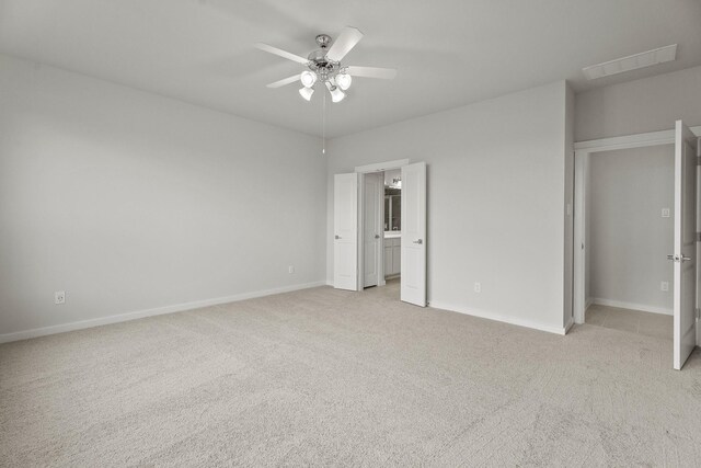 13122 Leisure Cove Dr, Texas City, TX 77568 - unfurnished bedroom featuring light carpet, baseboards, and a ceiling fan
