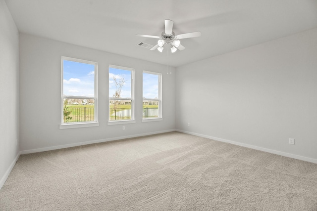 13122 Leisure Cove Dr, Texas City, TX 77568 - empty room featuring light carpet, baseboards, and ceiling fan