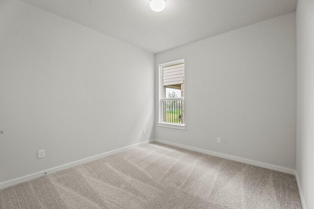 13122 Leisure Cove Dr, Texas City, TX 77568 - unfurnished room with light colored carpet and baseboards