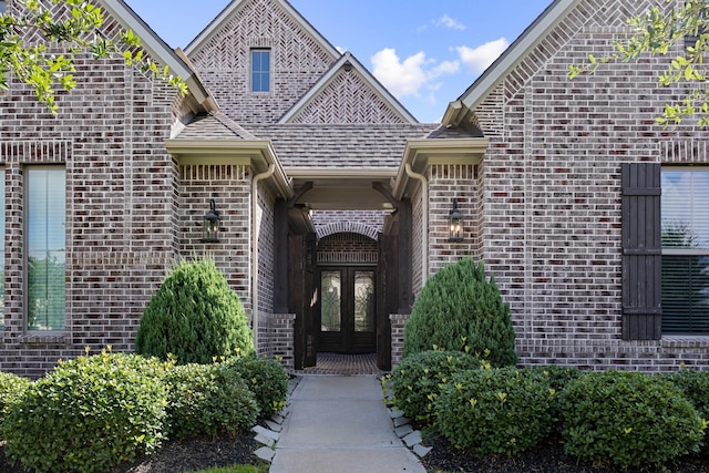 13630 E Palomino Lake Cir, Cypress, TX 77429 - view of exterior entry with french doors and brick siding