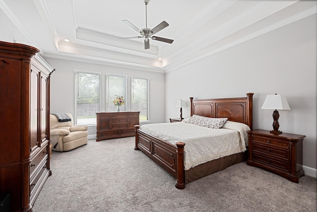 13630 E Palomino Lake Cir, Cypress, TX 77429 - bedroom featuring light colored carpet, ornamental molding, a ceiling fan, and a raised ceiling