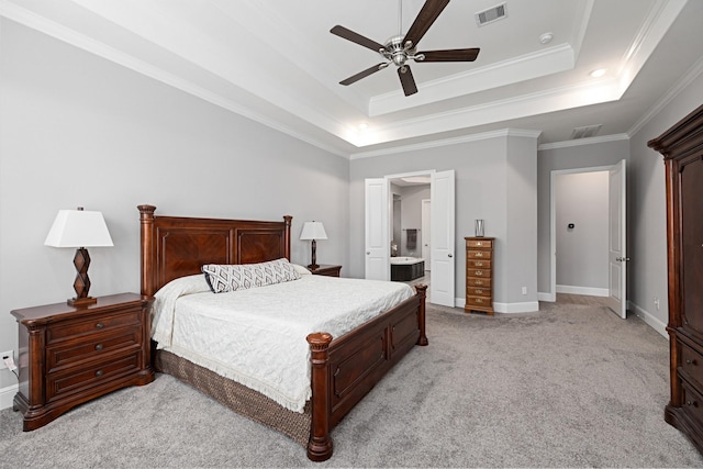 13630 E Palomino Lake Cir, Cypress, TX 77429 - bedroom with light carpet, a raised ceiling, crown molding, baseboards, and ensuite bathroom