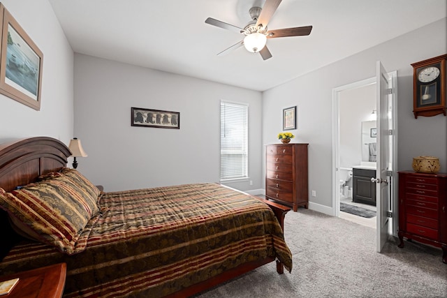13630 E Palomino Lake Cir, Cypress, TX 77429 - bedroom featuring carpet flooring, baseboards, ceiling fan, and ensuite bathroom