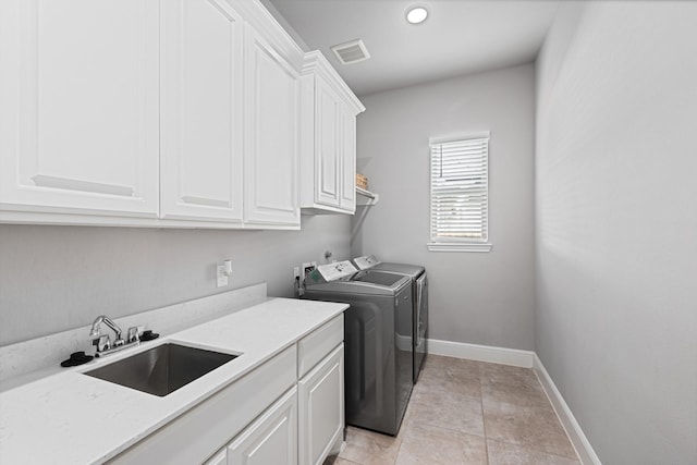 13630 E Palomino Lake Cir, Cypress, TX 77429 - washroom with cabinet space, washer and clothes dryer, baseboards, and recessed lighting