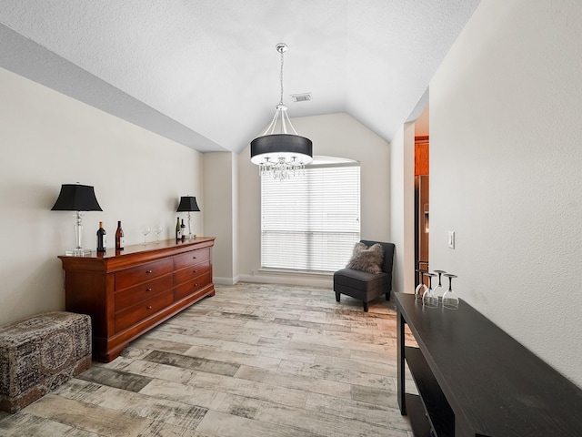 24602 Windemere Park Ct, Katy, TX 77494 - sitting room with light wood-style floors, vaulted ceiling, and a chandelier