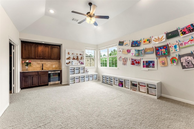 119 W Valera Ridge Pl, Spring, TX 77389 - recreation room featuring beverage cooler, light colored carpet, ceiling fan, bar with sink, and lofted ceiling