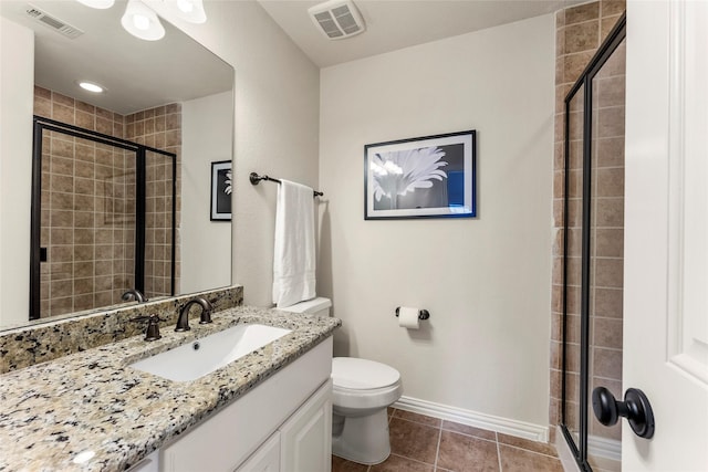 119 W Valera Ridge Pl, Spring, TX 77389 - bathroom featuring toilet, a shower stall, vanity, tile patterned flooring, and baseboards