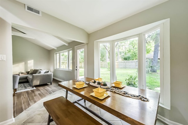 23011 Grand Rapids Ln, Spring, TX 77373 - dining area featuring lofted ceiling, baseboards, and wood finished floors