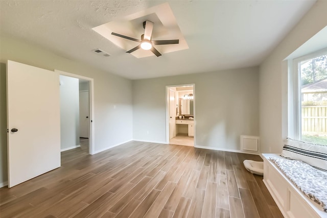 23011 Grand Rapids Ln, Spring, TX 77373 - unfurnished bedroom with wood finished floors, a ceiling fan, and baseboards