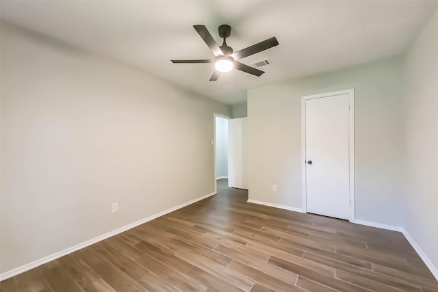 23011 Grand Rapids Ln, Spring, TX 77373 - unfurnished bedroom with wood finished floors, baseboards, and a ceiling fan