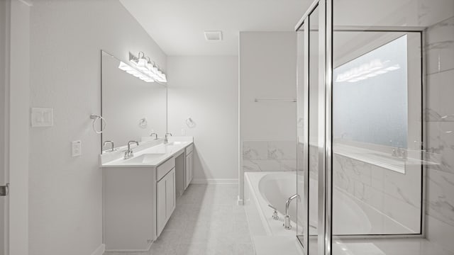 2405 Village Azalea Dr, Texas City, TX 77568 - bathroom with a garden tub, double vanity, baseboards, and a shower stall
