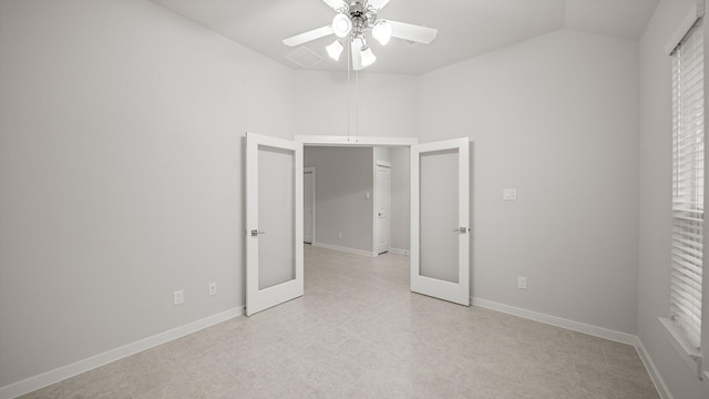 2405 Village Azalea Dr, Texas City, TX 77568 - unfurnished bedroom with lofted ceiling, baseboards, a ceiling fan, and french doors