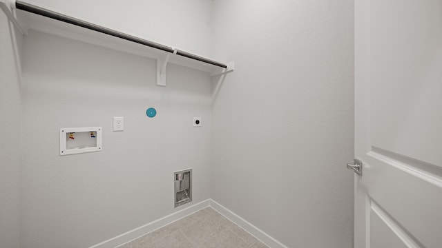 2405 Village Azalea Dr, Texas City, TX 77568 - washroom featuring electric dryer hookup, washer hookup, baseboards, light tile patterned floors, and gas dryer hookup