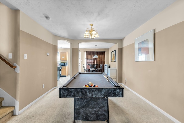 11735 Alief Clodine Rd Unit 34, Houston, TX 77072 - rec room featuring arched walkways, carpet floors, a chandelier, billiards, and a textured ceiling