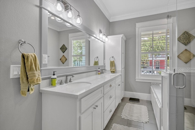 9 Broad St, Galveston, TX 77554 - full bath featuring double vanity, ornamental molding, tile patterned flooring, a garden tub, and baseboards