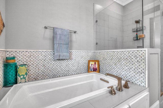 9 Broad St, Galveston, TX 77554 - bathroom featuring a garden tub and tiled shower