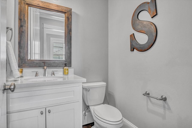 9 Broad St, Galveston, TX 77554 - bathroom with toilet, vanity, and baseboards