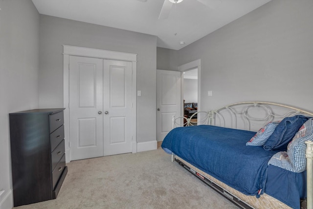 9 Broad St, Galveston, TX 77554 - bedroom with light carpet, a closet, and ceiling fan