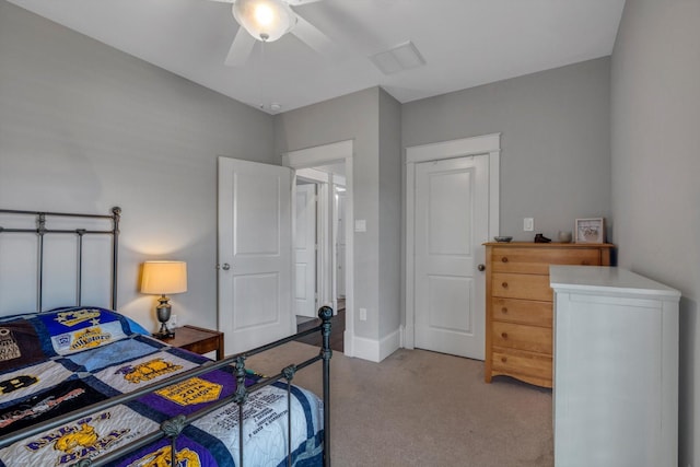 9 Broad St, Galveston, TX 77554 - bedroom with light colored carpet, ceiling fan, and baseboards