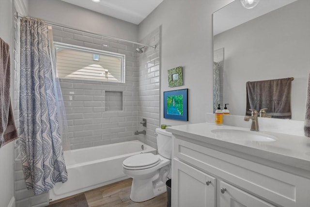 9 Broad St, Galveston, TX 77554 - bathroom featuring vanity, shower / tub combo, wood finished floors, and toilet