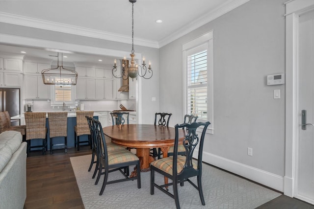 9 Broad St, Galveston, TX 77554 - dining area with a chandelier, dark wood-style flooring, healthy amount of natural light, crown molding, and recessed lighting