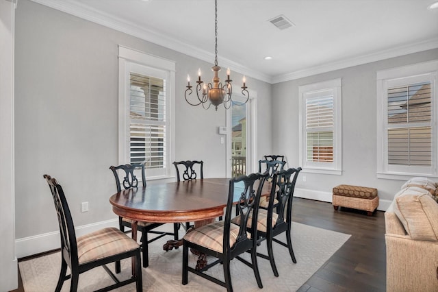 9 Broad St, Galveston, TX 77554 - dining space featuring a chandelier, baseboards, dark wood-style flooring, recessed lighting, and ornamental molding
