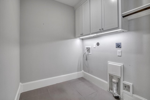 9 Broad St, Galveston, TX 77554 - laundry room featuring hookup for an electric dryer, hookup for a washing machine, cabinet space, hookup for a gas dryer, and baseboards
