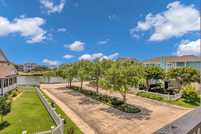 9 Broad St, Galveston, TX 77554 - view of community featuring driveway, a residential view, and a water view